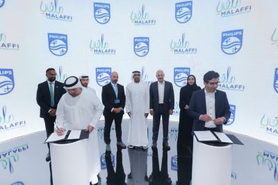 Philips and Malaffi representatives signing agreement at Arab Health 2024