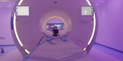 Philips Ingenia Ambition 1.5T X MRI scanner featuring patient comfort visuals and ambient lighting for a relaxed scanning experience