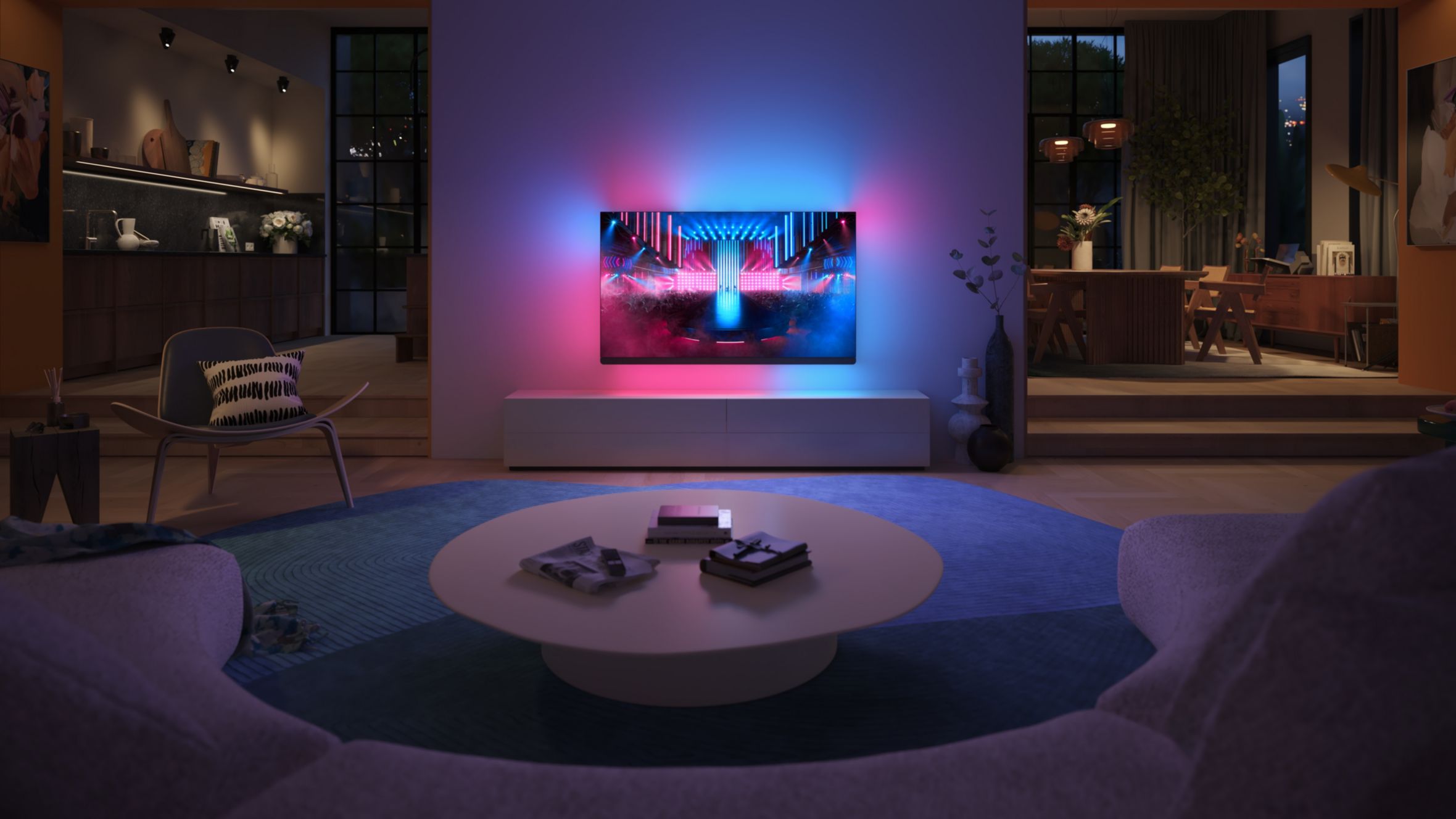 T&eacute;l&eacute;viseur Philips Ambilight projetant une lumi&egrave;re bleue et rose dans un salon moderne faiblement &eacute;clair&eacute;.