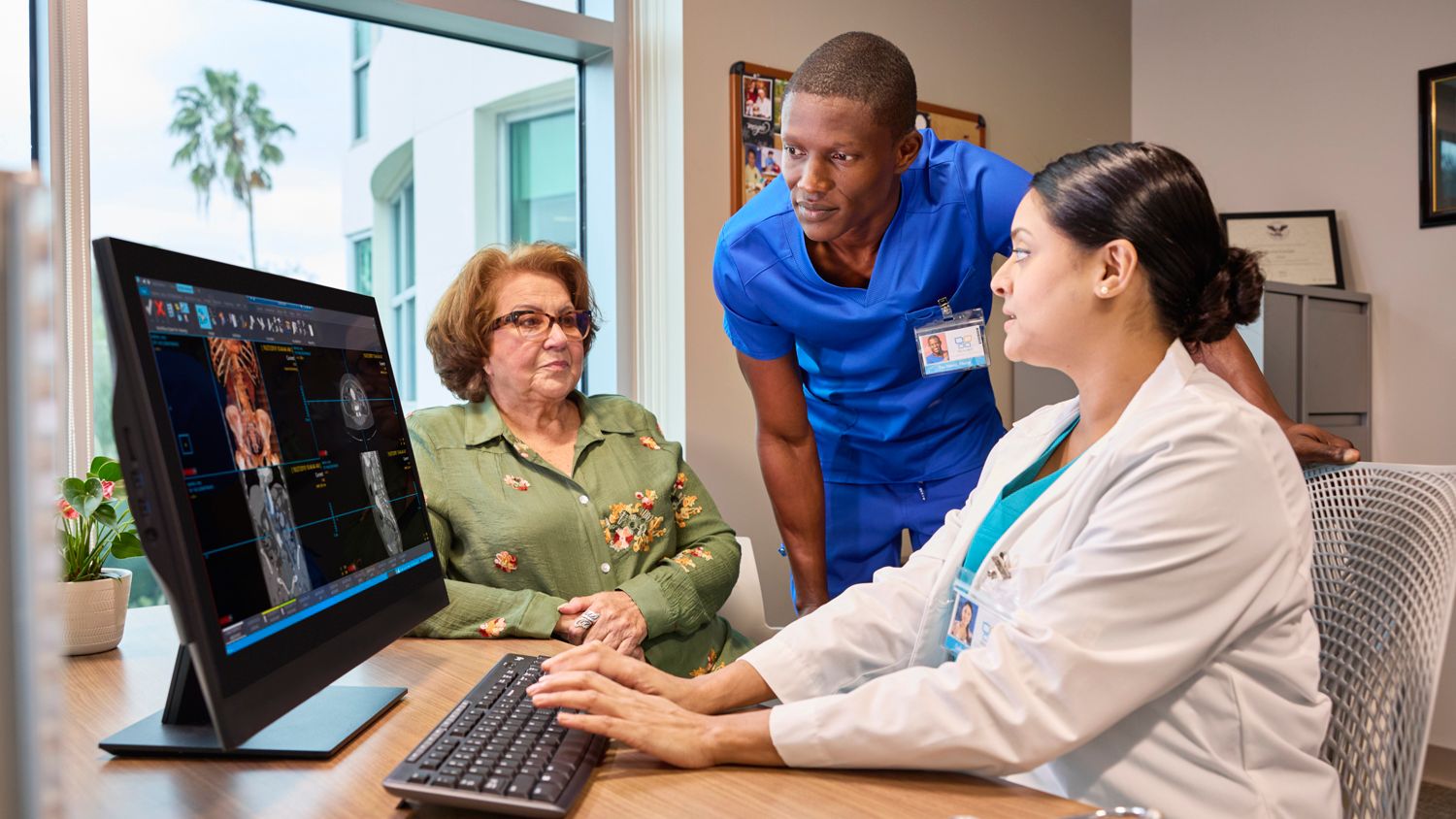 Doctors with Patient reviewing a case on PACS
