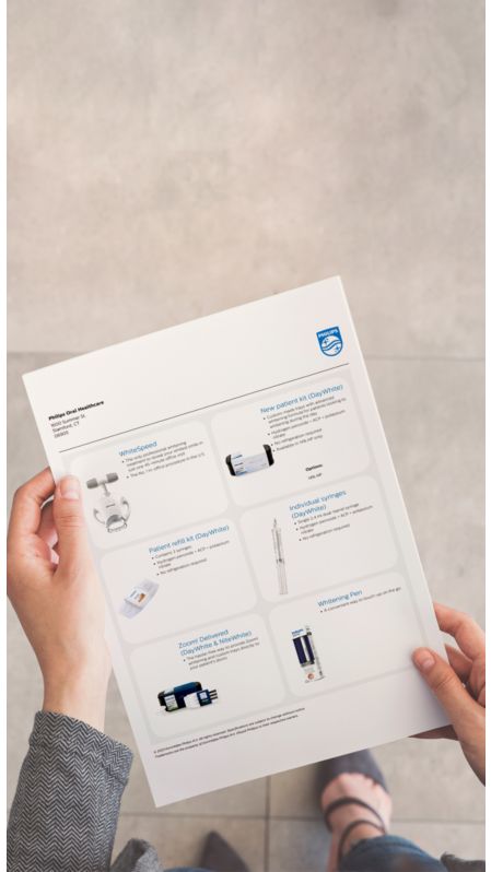 A dental professional holding a customized product sheet.