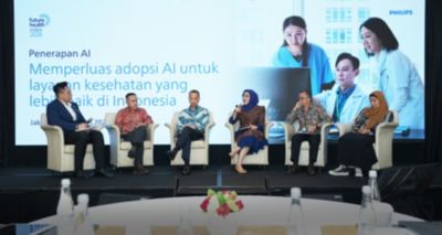 	Astri Ramayanti Dharmawan speaks during the FHI 2026 Indonesia panel discussion on responsible AI in healthcare.