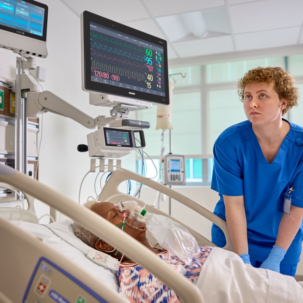 Clinician monitoring patient using intellivue monitor and neuron
