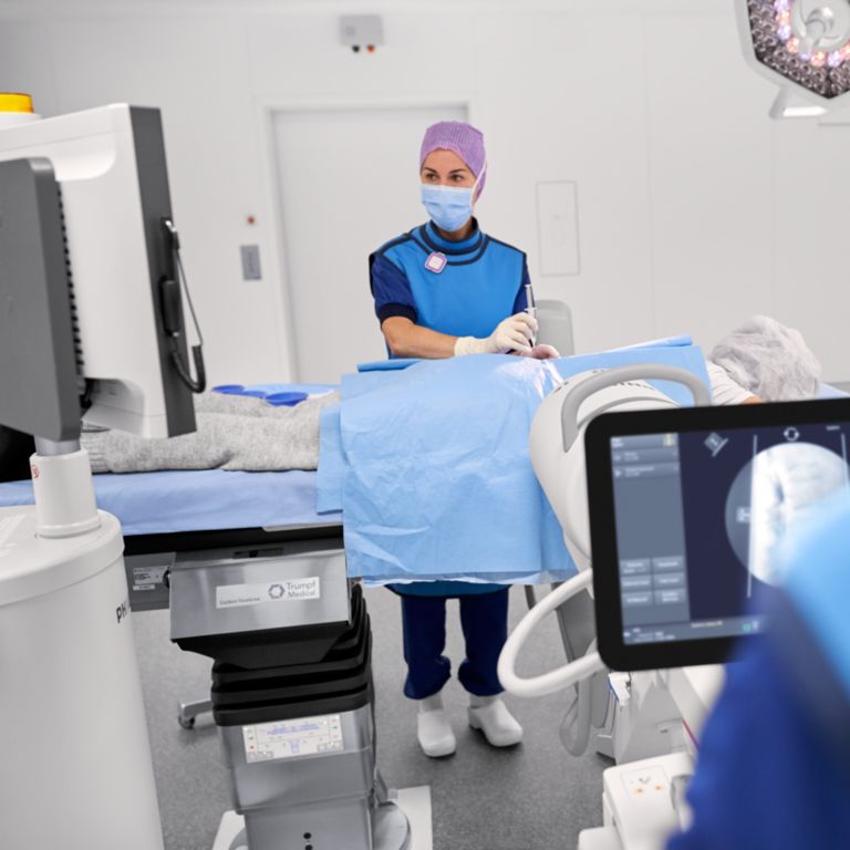 Surgical team performing pain treatment with Zenition II mobile C-arm