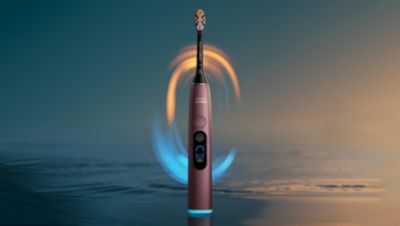 Real-time lighting guidance makes brushing feedback visible on the handle