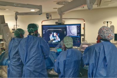 Close up of clinical monitor displaying intracardiac imaging and vital signs during cardiac procedure