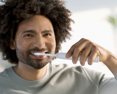 Man brushing with a Sonicare 2300 power toothbrush