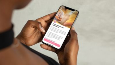 Person using Pregnancy+ app to access Michigan home visiting programs