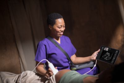 Midwife using Lumify device with doctor in medical setting
