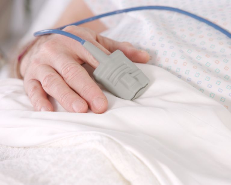Glove sensor on patient's hand