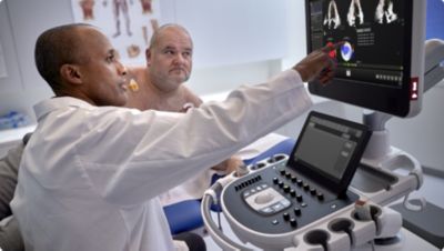 Image of clinician and patient in echo lab