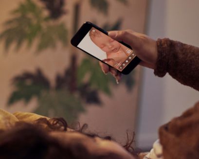 Person using the Pregnancy⁺ app on phone
