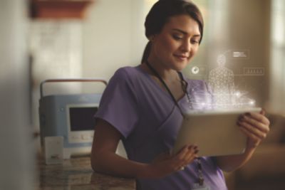 Healthcare professional using tablet for remote monitoring