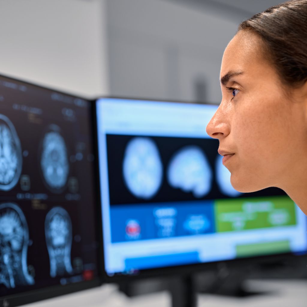 Care provider looking at a radiology scan