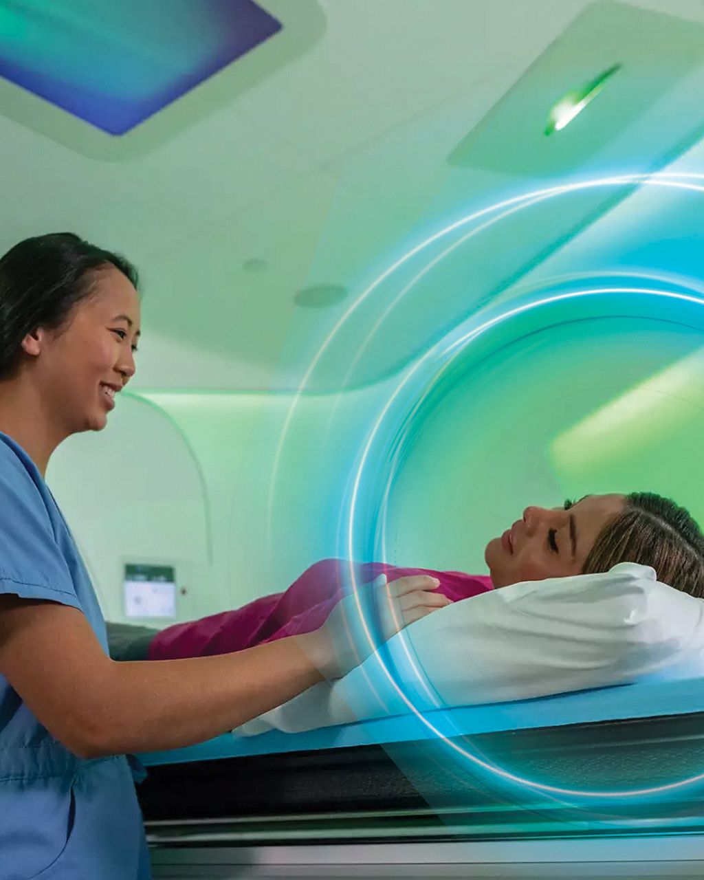 female tech and patient in ct scanner