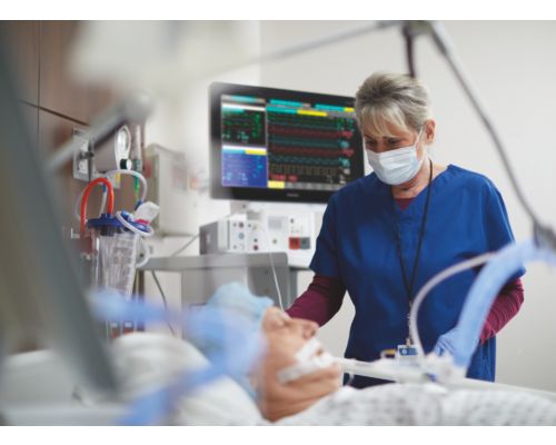 Nurse with male patient in ICU CCU