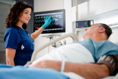 Nurse caring for male patient with MX850 and X3