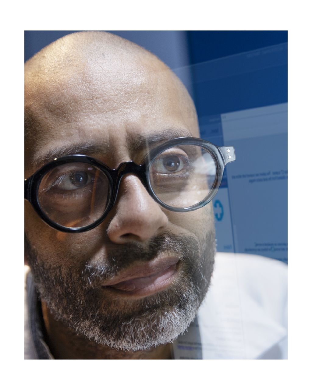 Radiologist reviewing screens.