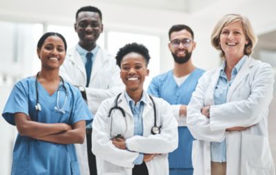 Healthcare team of doctors and nurses standing together in a hospital environment