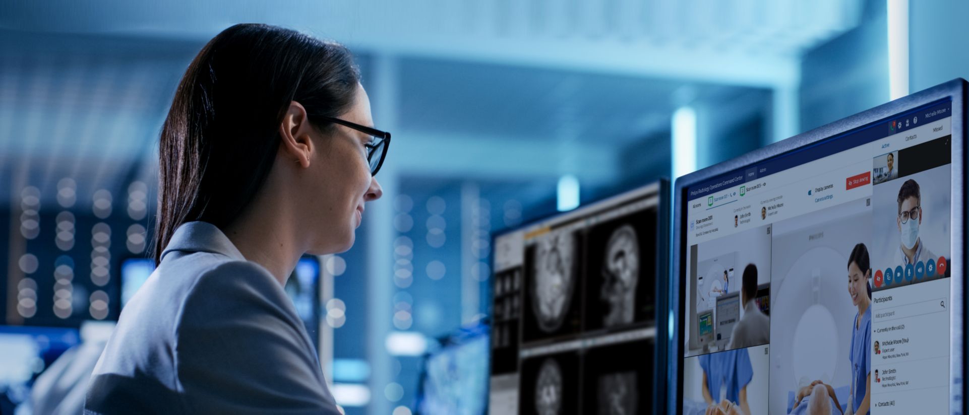 Care provider looking at radiology operating center screens