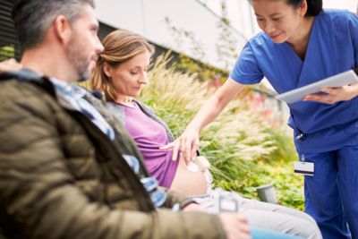 Dad and mom with beltless pod and patch outside the hospital