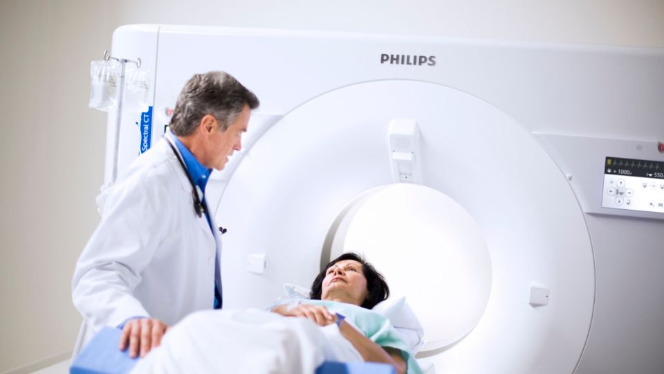 Patient and clinician during CT scan
