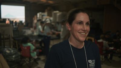 Healthcare volunteer speaking during community outreach