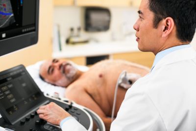 Clinician performing an abdominal ultrasound scan using a Philips Affiniti system.