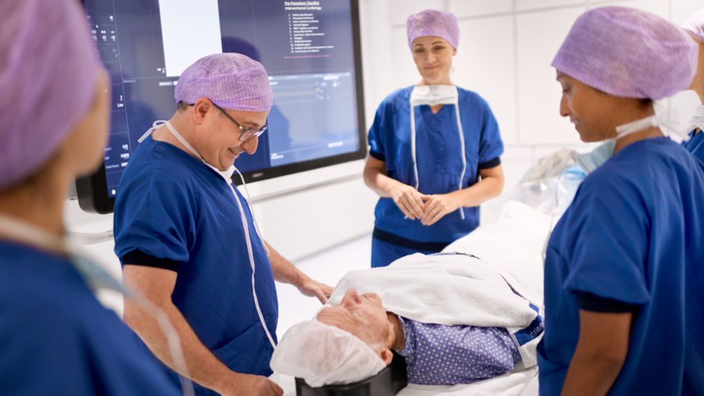 Cardiology team with patient