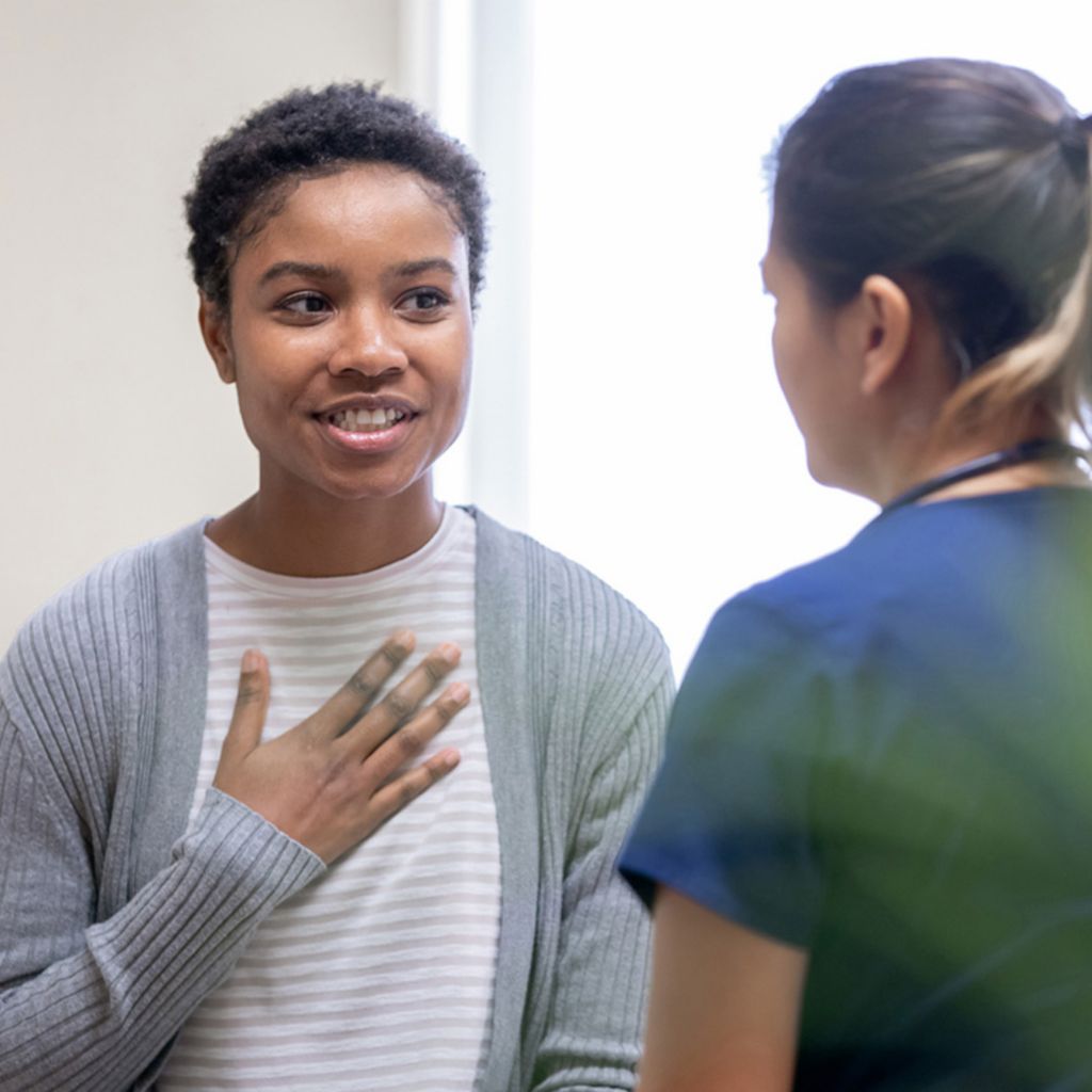 Woman and care provider talking