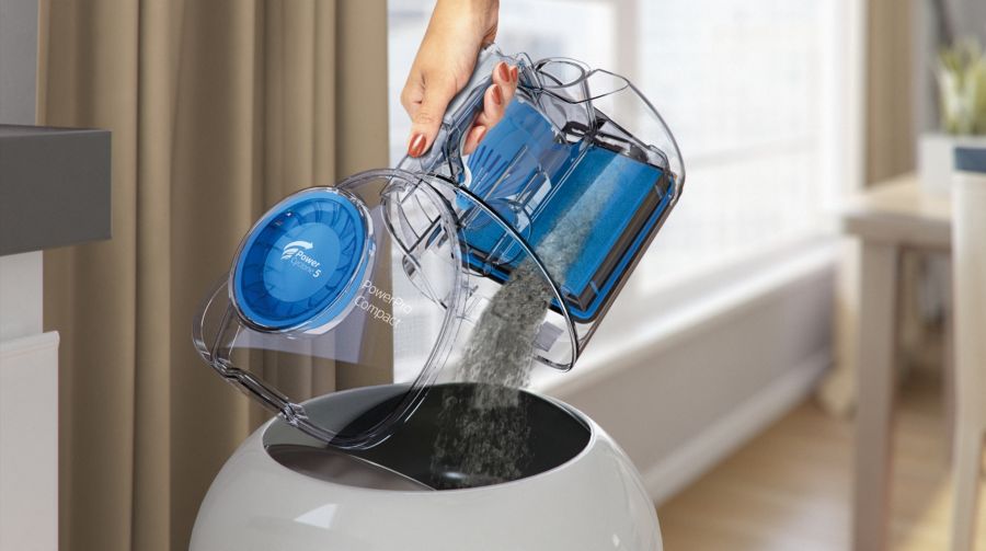 Dust container designed for hygienic emptying with one hand