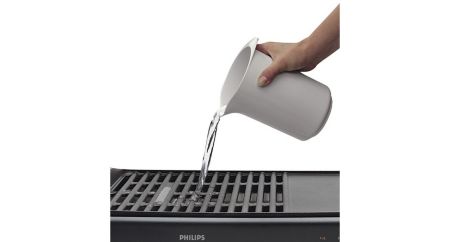 Water tray prevents food particles and grease from burning