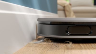 Sūciet putekļus gar sienām un stūros