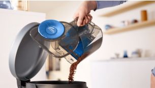 Bac &agrave; poussi&egrave;re con&ccedil;u pour &ecirc;tre vid&eacute; proprement d'une seule main