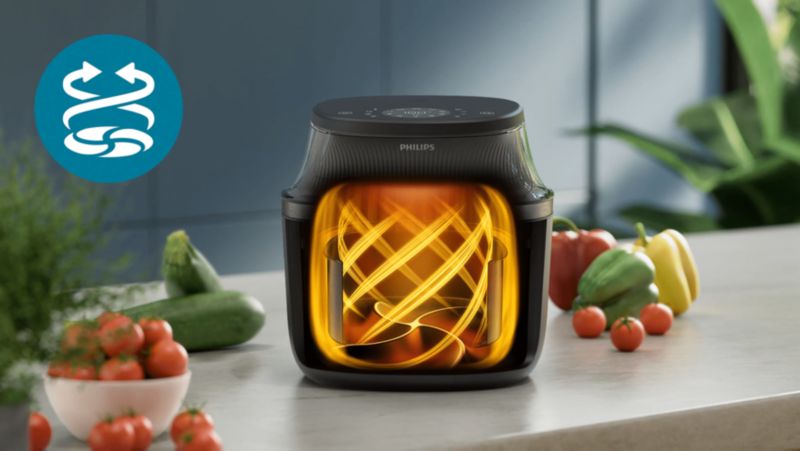 Philips Airfryer with hot air circulating around the food inside the basket